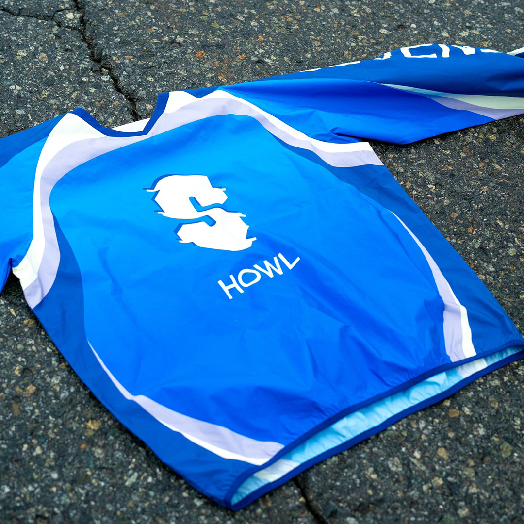 SOUVENIR SNOWBOARDING （スーベニア スノーボーディング）| SOUVENIR X HOWL WINDPROOF STRETCH MOTO SHIRT 2026 / SKY BLUE | スノーボード・スケートボードのTACTICS JAPAN